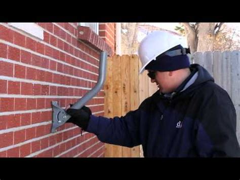 mounting metal bracket on brick exterior|mounting large objects to brick.